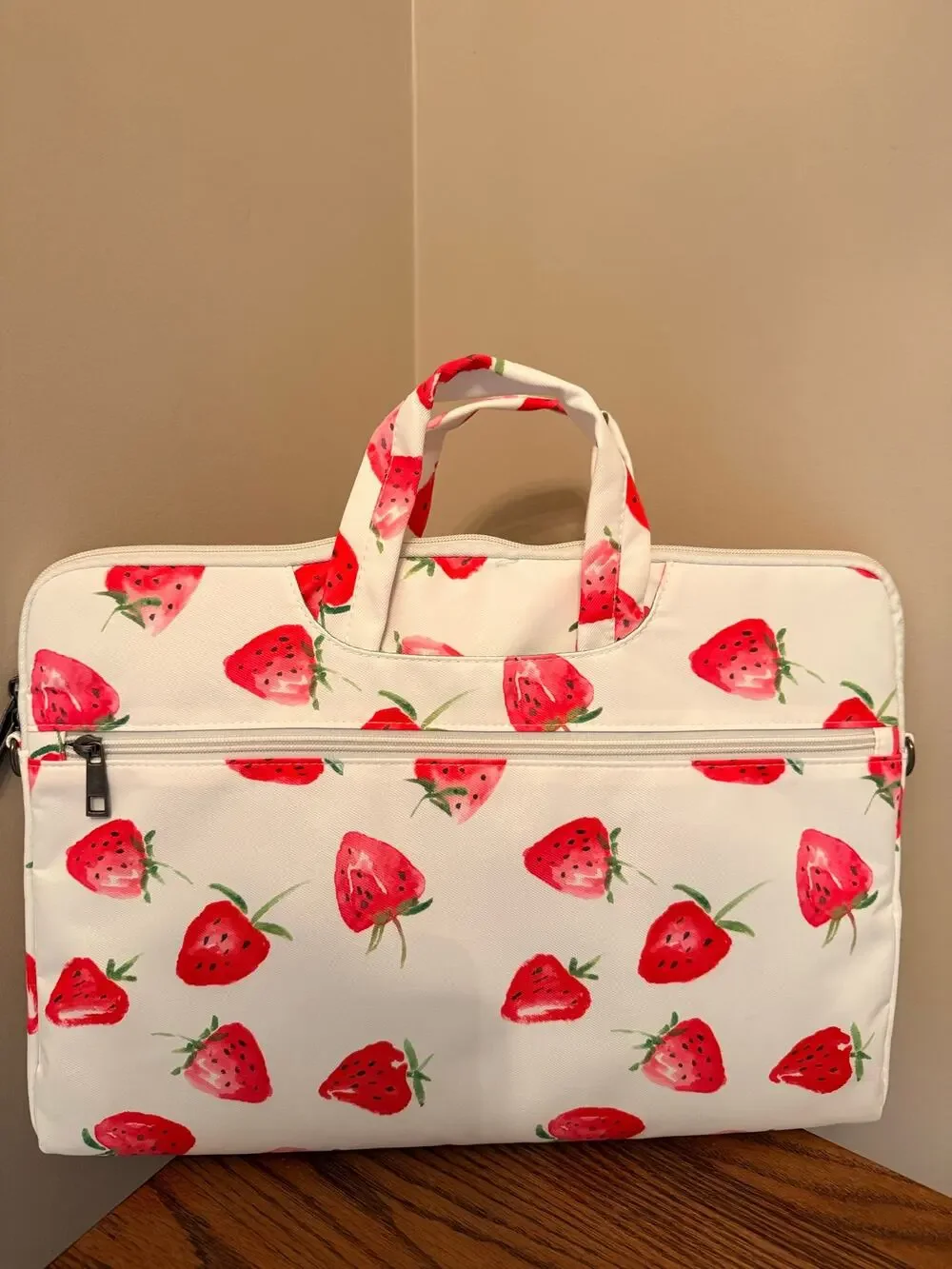 Canvaslove laptop sleeve features strawberry print, detachable shoulder strap